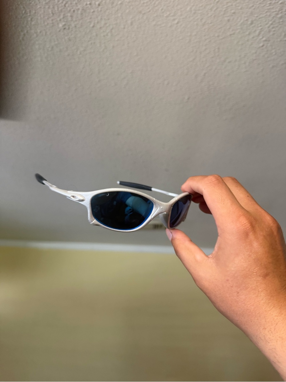 Oakley Silver Frame Blue Lens Performance Sunglasses